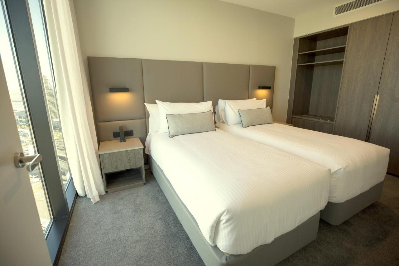 โอ๊ควูด พรีเมียร์ เมลเบิร์น Aparthotel ภายนอก รูปภาพ A bedroom at the hotel